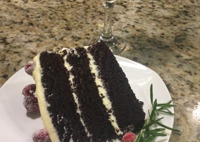Chocolate tahini cake with rosemary infused buttercream and candied cranberries